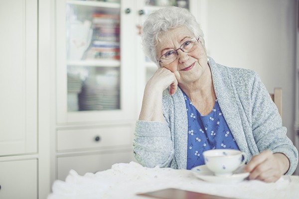 Senior smiling with a cup of tea