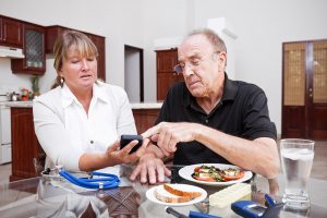 A man receiving daily diabetes care checks his glucose level.