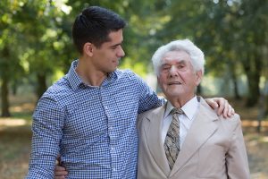 Caregiver walking with a senior.