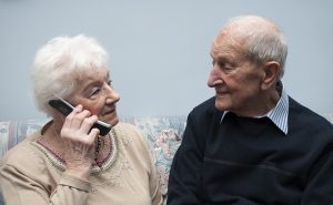 senior-couple-talking-on-phone